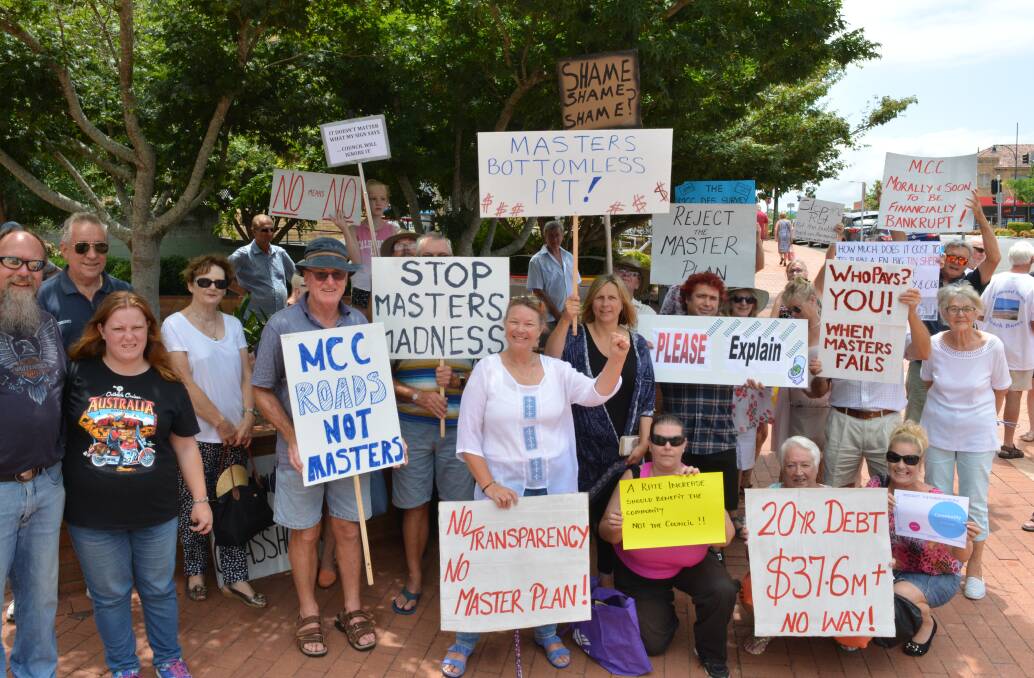 The ‘No MidCoast Council Move to Masters’ group set up their protest out from of the MidCoast Council Taree office. Photo Anne Keen 