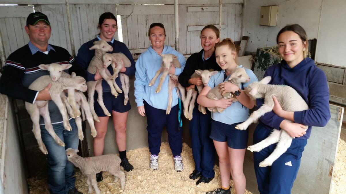 Troy Richards with the Gloucester High School year nine students and their newly adopted lambs. Photo supplied