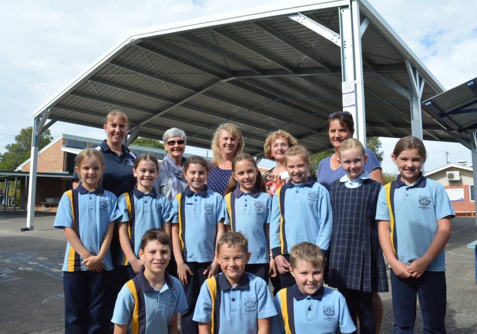 Members of the Gloucester Uniting Church with students from Gloucester Public School and members of the P&C. Photo Anne Keen