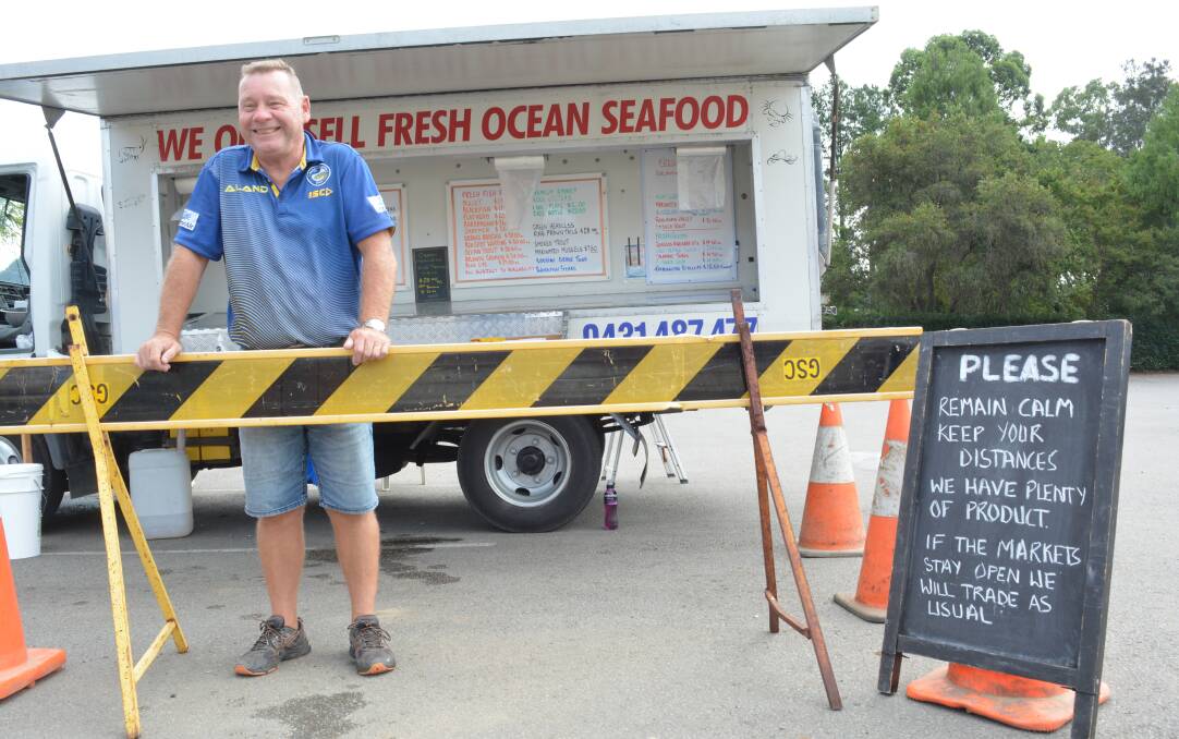 Bob Beechey kept pandemic safe behind the barrier at Bruce's Seafood truck in Gloucester during lockdown. Photo Anne Keen