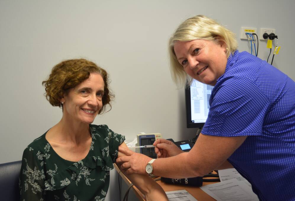 Gloucester's first COVID vaccine was given to Dr Michele Hogg by registered nurse Sue Wallace.