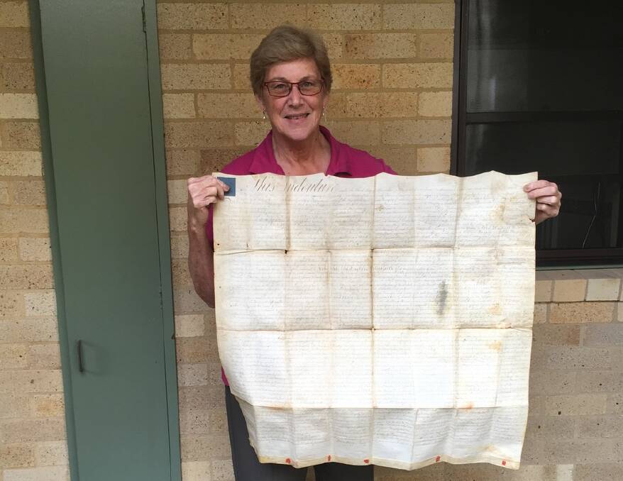 Lyn Stewart with the 1801 marriage agreement of her great, great, great grandparents which marked the first break through. Photo supplied 