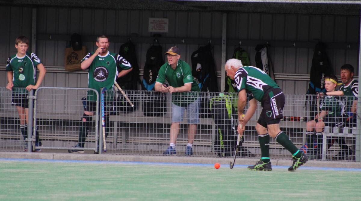 Bruce Snape has possession of the ball in front of the Gloucester Panthers dugout during a match on the TLF field during the 2020 season.