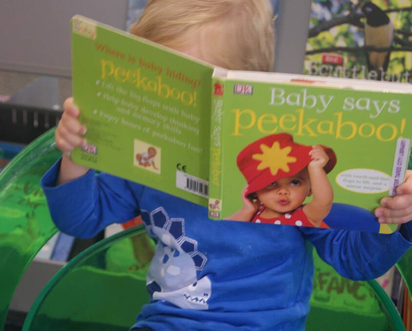 Getting lost in the world of books is an experience for every age. Photo courtesy of MidCoast Council.