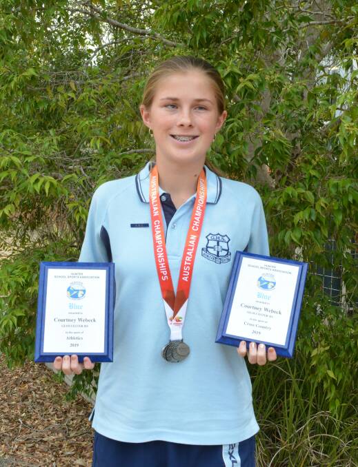 Courtney Webeck with her two Hunter School Sporting Association Sporting Blues and the silver medal she won at the All Schools Nationals in Perth. Photo Anne Keen 