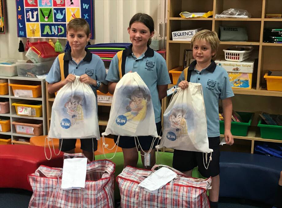 Liam Wamsley, Jess Marchant and Brodie Baker presented the Bobin students with the Project KIN packs. Photo supplied