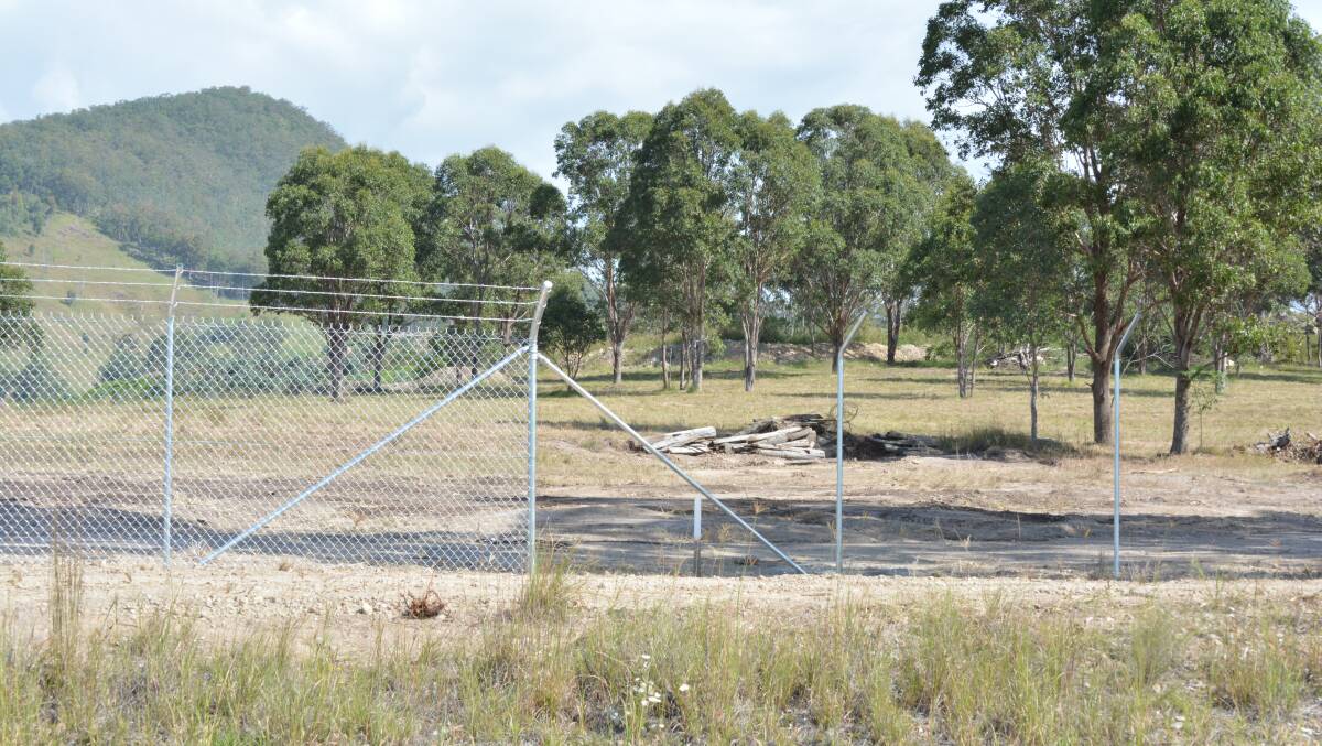 MidCoast Council begins construction of a perimeter fence to meet EPA requirements. Photo Anne Keen