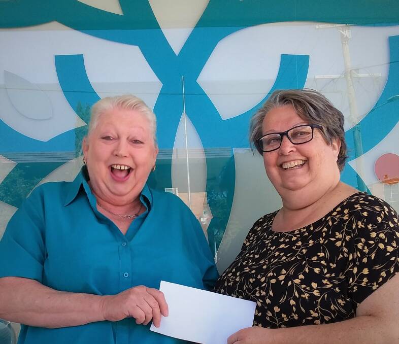Bucketts Way Neighbourhood Group emergency relief coordinator Kim Wiesner is excited to receive the cheque from Gloucester CWA evening branch member, Donna Kemp.