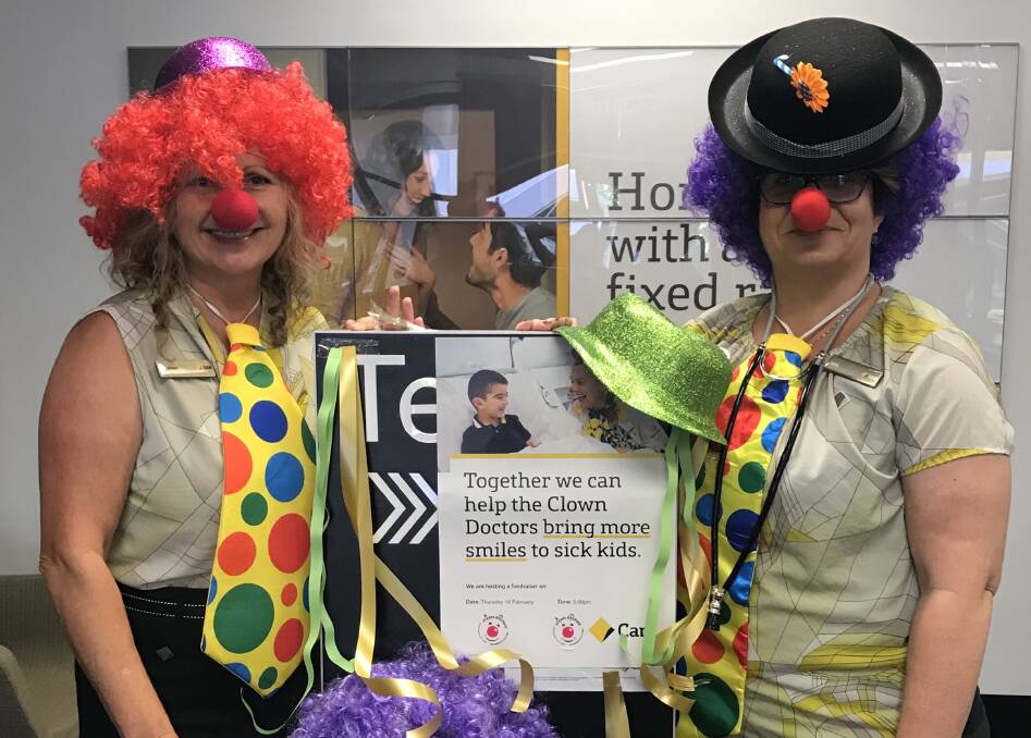 Dearne Batchelor and Jane Richardson get in the spirit of things at Gloucester CBA branch. Photo supplied