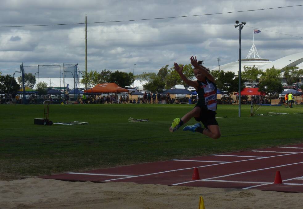 Kelly Groves in action competing in triple jump. Photo supplied