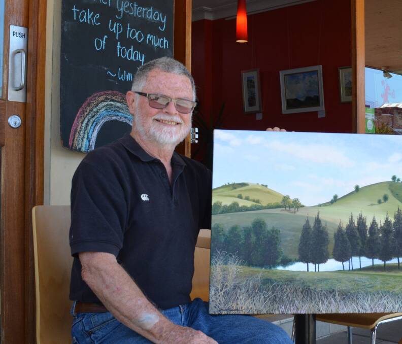 Fred Bullen with his painting 'Toward Gloucester' that he sold to help raise money for drought relief in 2018.