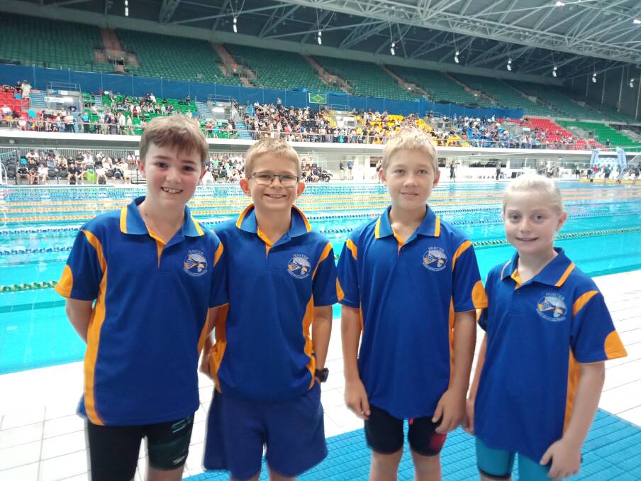 Oliver Laurie, Charlie Coombe, Riley Blanch and Saige Partridge get ready for swim. Photo Dave Keen 