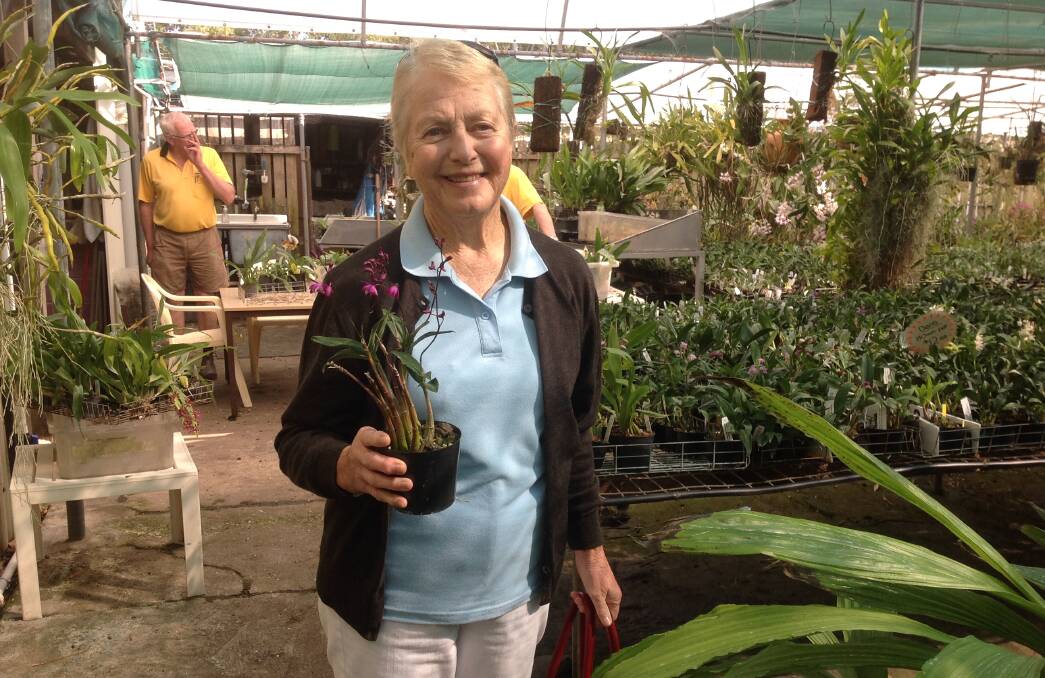Marlene Curby enjoying the visit to the Tinonee Orchid Nursery. Photo supplied