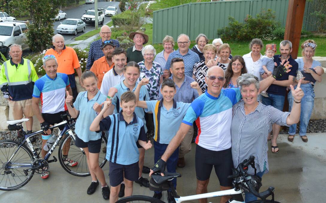 Mike King returns home to find his family and friends gathered to greet him after his bicycle ride across Australia. Photo Anne Keen
