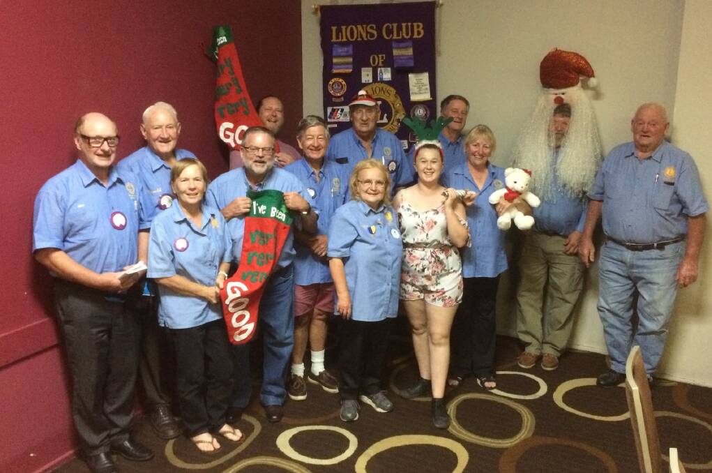 Members of the Lions Club of Gloucester getting into the Christmas spirit at a recent meeting. Photo supplied