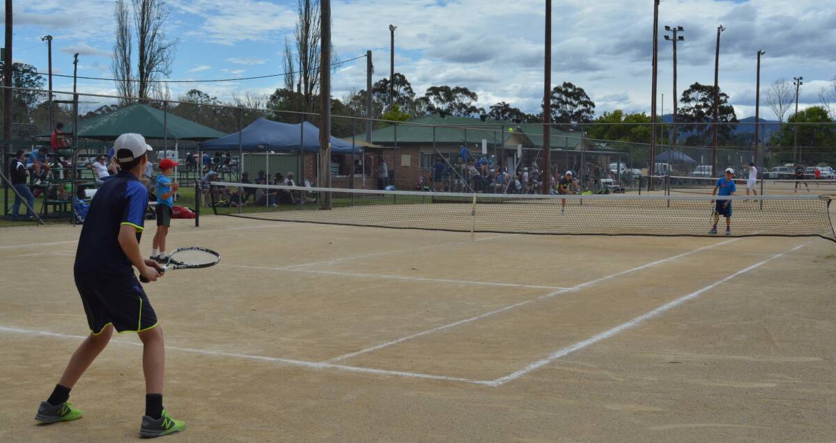 What a crowd: The Gloucester Open AMT and JT tennis competition drew a large group of players and spectators to the courts over the long weekend. Picture: Anne Keen 