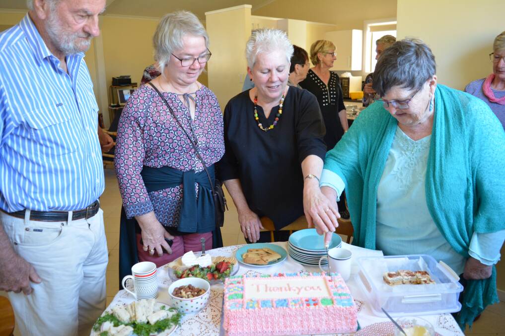 Let the celebration begin: Kit Carson, Louise Collins, Anne Noell and Jenny Fletcher cut the cake. Photo: Anne Keen