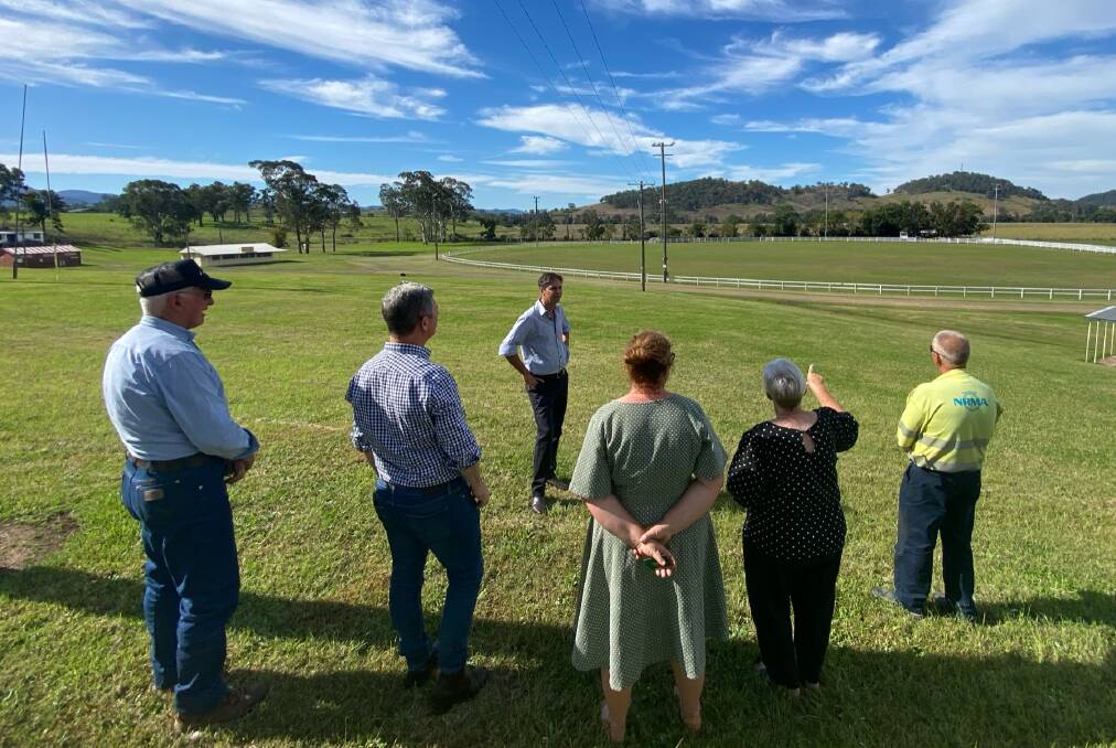 Members of the Gloucester AH&P Association show Dave Layzell where the new multi purpose building will be located. Photo supplied