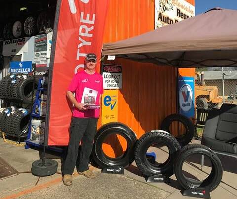 Adam Glew from Gloucester Rego & Tyre Centre gets his pink shirt ready for Pink Fitter Day. Photo supplied.