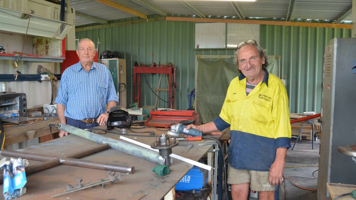 Barry Plumridge and Joe Cook in the engineering shed of the Gloucester Men's Shed. Photo Anne Keen