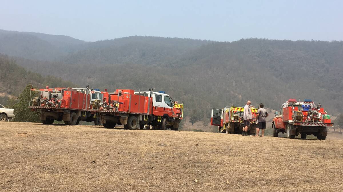 Fire trucks gathering in the area near the Woko fire form their own community on the fire ground. Photo Kim Wiesner. 