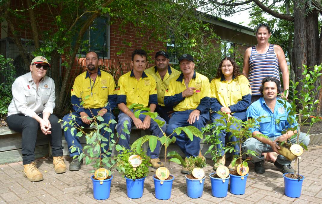 Working bee: The group TIDE staff worked to place the plants at Gloucester Public School before heading to Minimbah Community Garden. Photo Anne Keen