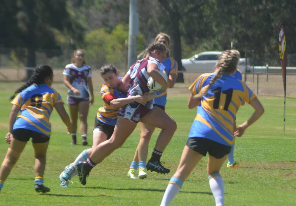 Tayla Predebon tries to beat a tackle while playing for the Hastings League l representative side at the CRL selection trials in 2018. Photo Rod Thompson