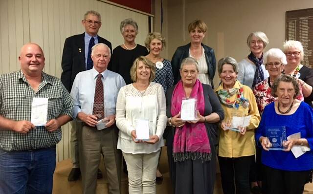Gloucester's Unsung Heroes and the nominators during the celebration evening at the Gloucester Bowling Club in 2018. Photo supplied