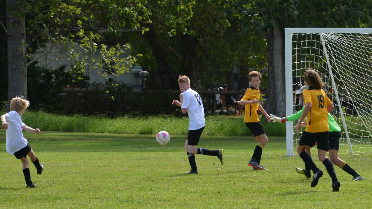 16's - Kayden Schumann going for a goal along with Zeke Llewellyn. Photo supplied
