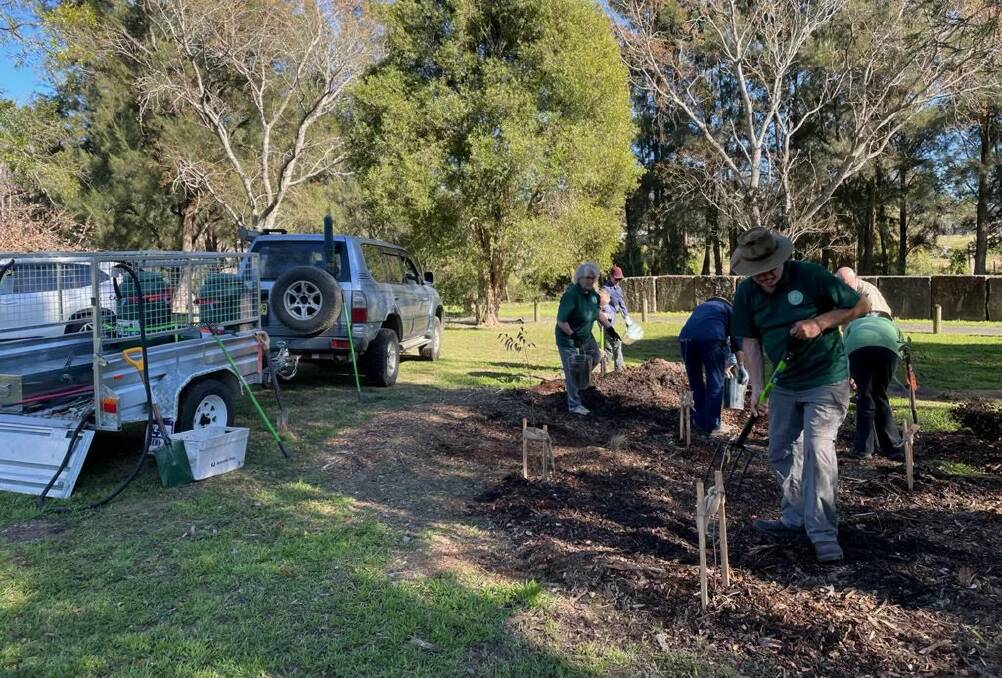 Gloucester Environment Group members busy planting eucalypts in Gloucester District Park for National Tree Day. Photo supplied