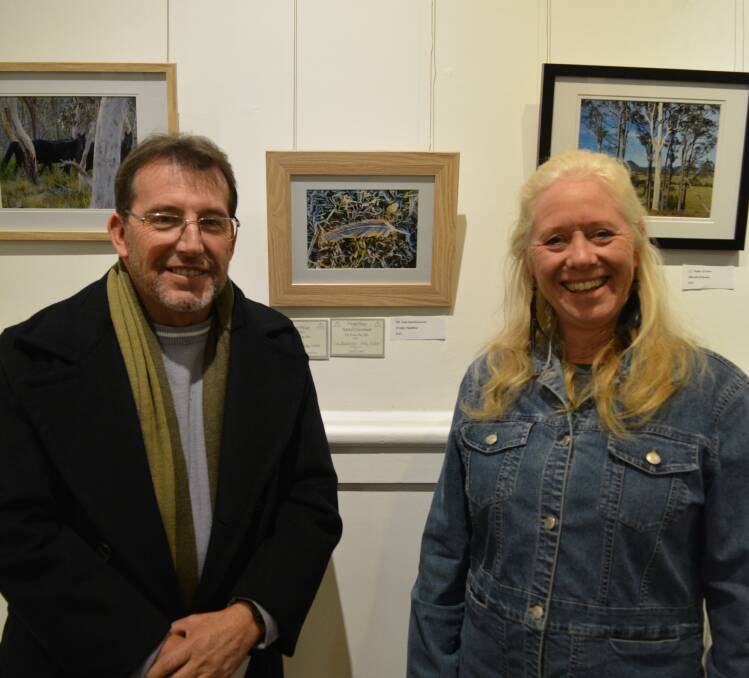 Pix from the Stix judge Stephen Barry with major prize winner, Lea McKinnon and her photograph "Frosty feather". Photo Anne Keen