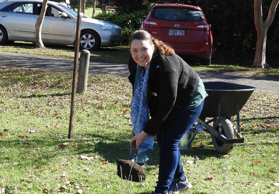 Councillor Katheryn Smith planted a planted dwarf mulberry tree at the Gloucester Community Garden Foundation Day event. Photo supplied