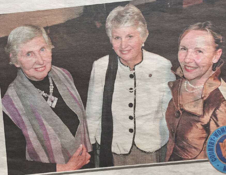 A newspaper clipping from The Land, May 14, 2009 with Christine pictured on the left wearing a vest she modelled made by a fellow branch member.