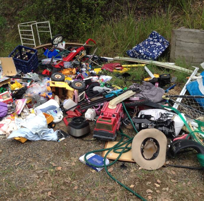 Shocking discovery: The pile containing household goods, ranging from children’s toys to unopened food, has been collected. Picture: Gayle Hollingsworth