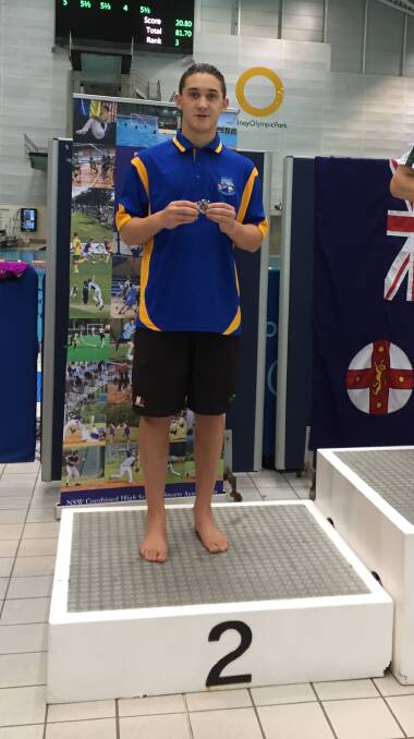 Raffa Francesci at the medal presentation ceremony for Combined High Schools in 100m butterfly race. Photo supplied