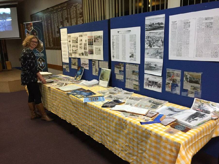 Deb Tuckerman from MCC looking over the table display provided by the
Gloucester Historical Society