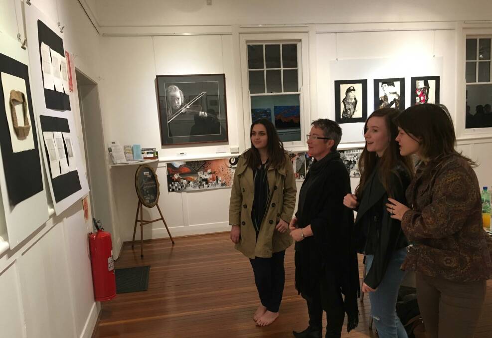 Art appreciation: Tiana Harford, Fiona O'Brien, Ruby Pippen and Indira VirziHartigan enjoy the exhibition in the gallery. Photo: Chris Steele