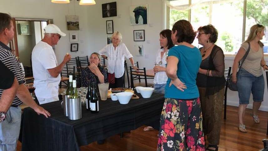 The official launch at the Krambach bistro including Garry Muller, publican of Krambach Hotel (far left) and deputy mayor Katheryn Smith who popped in for the afternoon to meet with some of the artists. Photo supplied