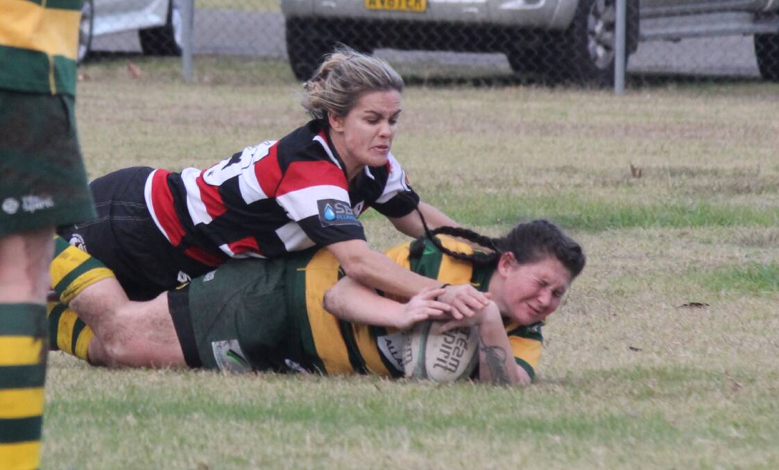 You're going down: Gloucester's Kelly Rees takes down Forsters hooker, Demi Fox during the home game at the Number One oval. Photo Kirsten Jory