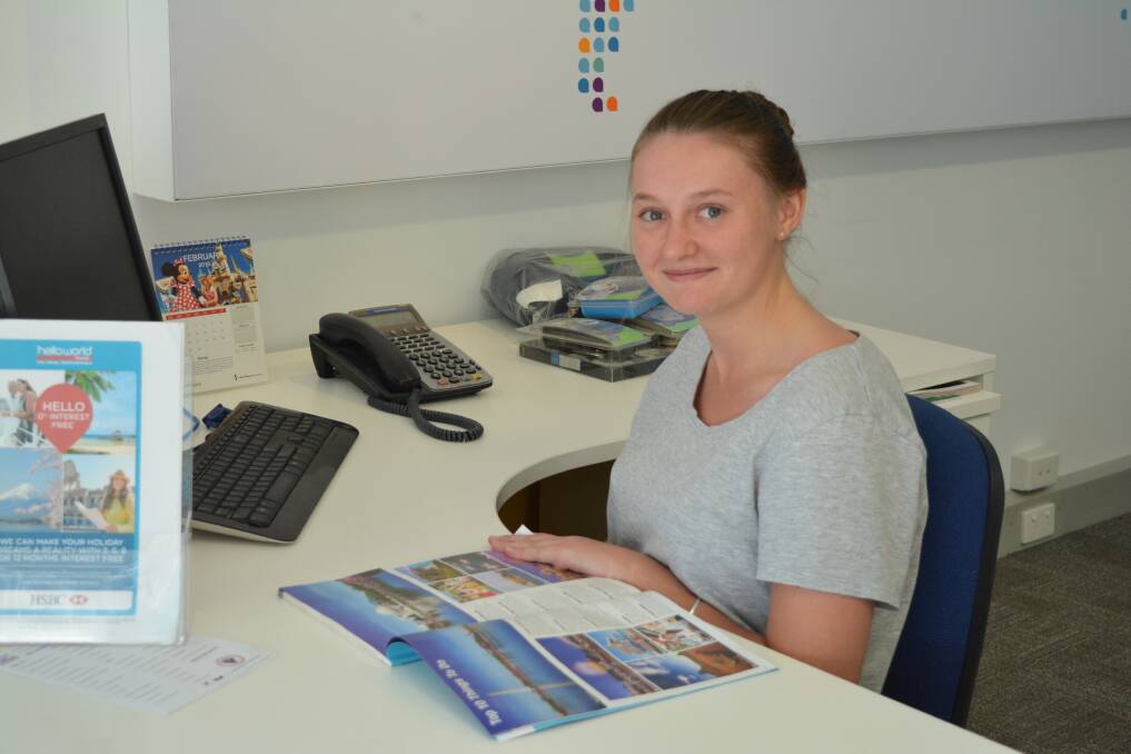 Leah Smith learns about travelling to America during her time at Helloworld Travel Gloucester. Photo Anneka Hooke