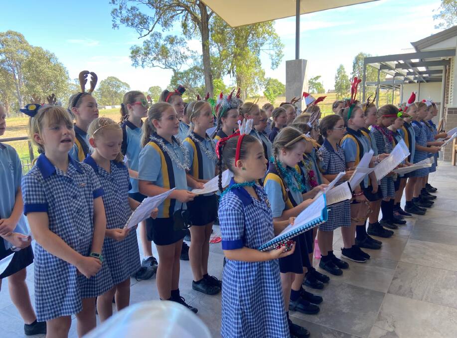 Gloucester Public School choir members sing Christmas carols for the residents of Mirrabooka Place. Photo supplied