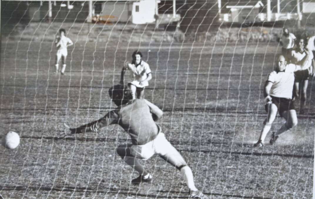 He shoots, he scores: John Hughes is pictured on the far right kicking a penalty goal while playing for Gloucester against Taree, year unknown. 