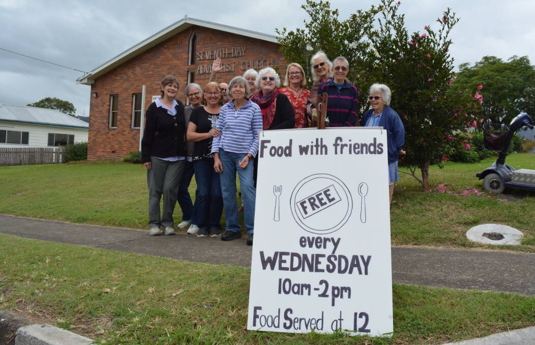 Food with friends: Community volunteers are feeling good about the first day of their new venture. Picture: Anne Keen