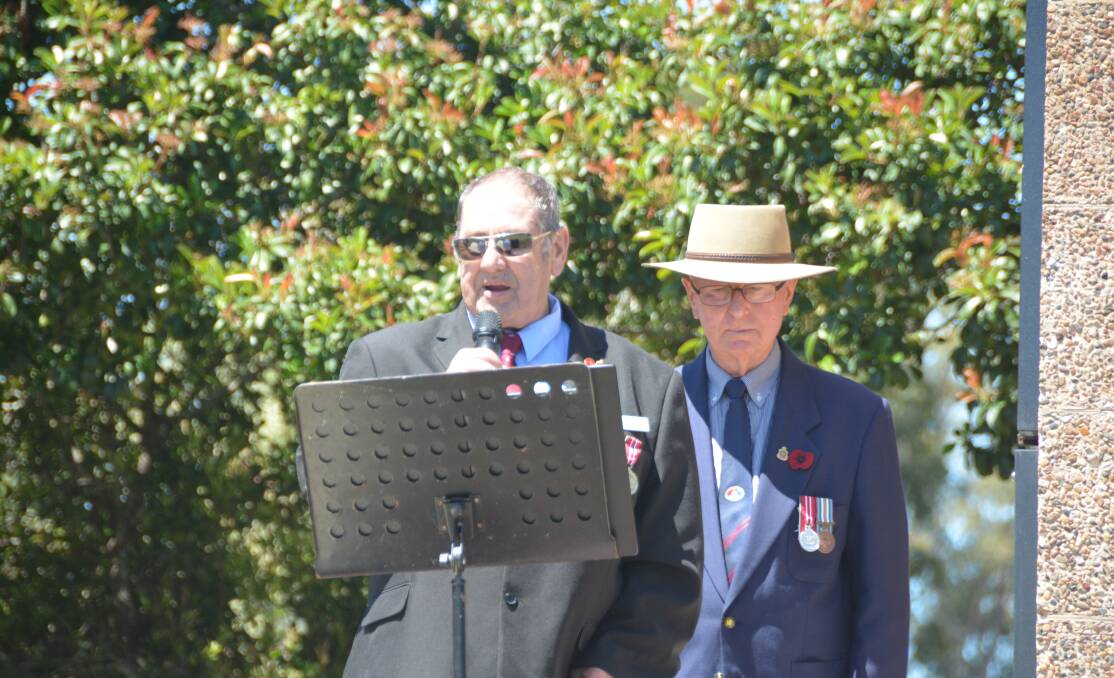 Gloucester RSL Sub Branch president Dallas Heard speaking at the 2020 Remembrance Day ceremony at Gloucester Memorial Park with fellow member, Bob Hewett.