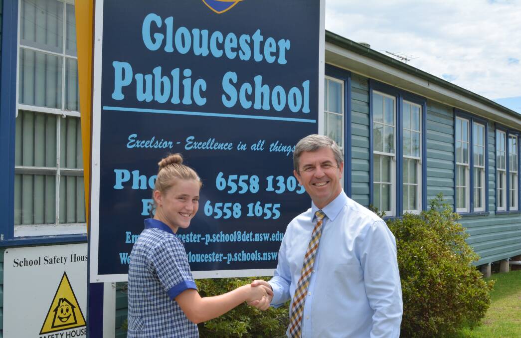 A handshake: Emily Kearney with David Gillespie at Gloucester Public School in December 2017. Photo: Anne Keen