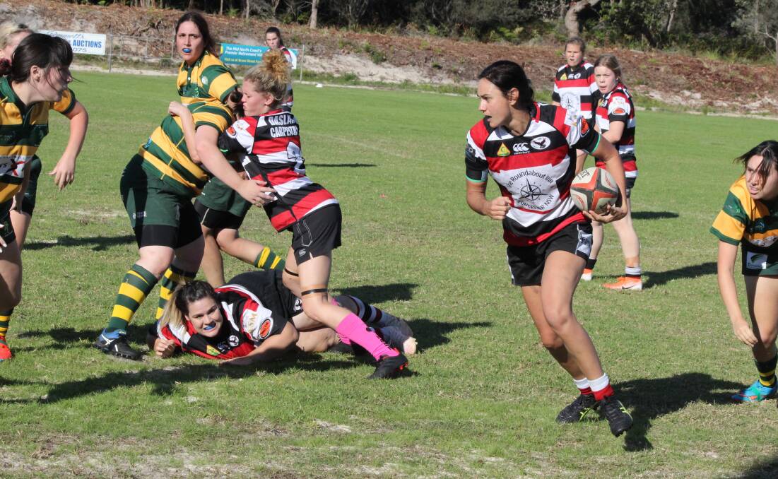 Team work: Claire Shultz running with the ball, Shyanne Riley on the ground and Taylor Scanlon pushing on the Forster player. Photo Kirsten Jory