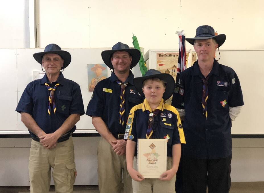 The current Gloucester Scout Group leaders Pete Theo, Luke Sargent and Adam Glew with scout Seth Sargent. Photo Supplied 
