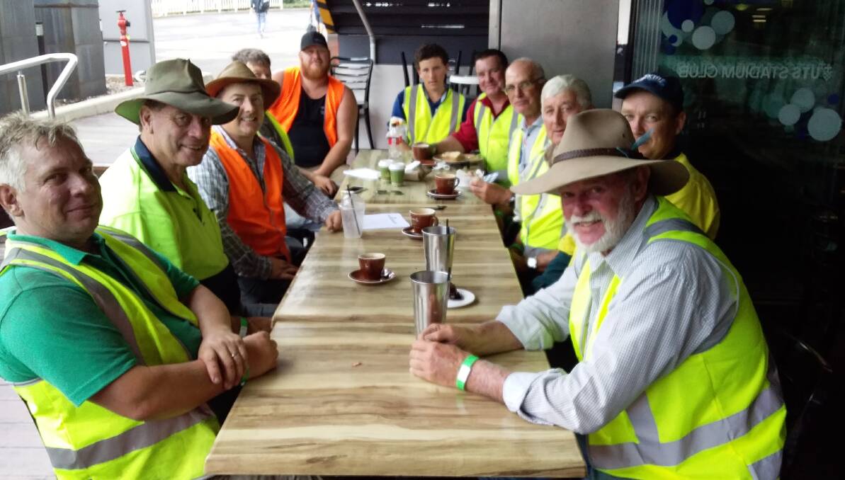 Gloucester's hard working volunteers having a well earned break during their venture to Allianz Stadium. Photo supplied.