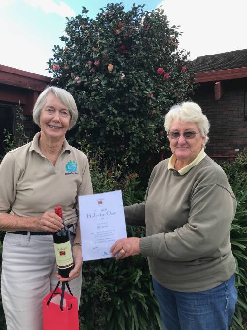 Jill Carson receiving her Hole in One prize from Margaret Dunn. Photo supplied