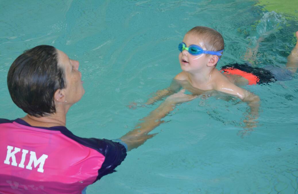 Learning to swim: Three-year-old Aiden Harris is learning to swim at Gloucester Olympic Pool and Hydrotherapy Pool with swim instructor, Kim Hebblewhite. Photo: Anne Keen